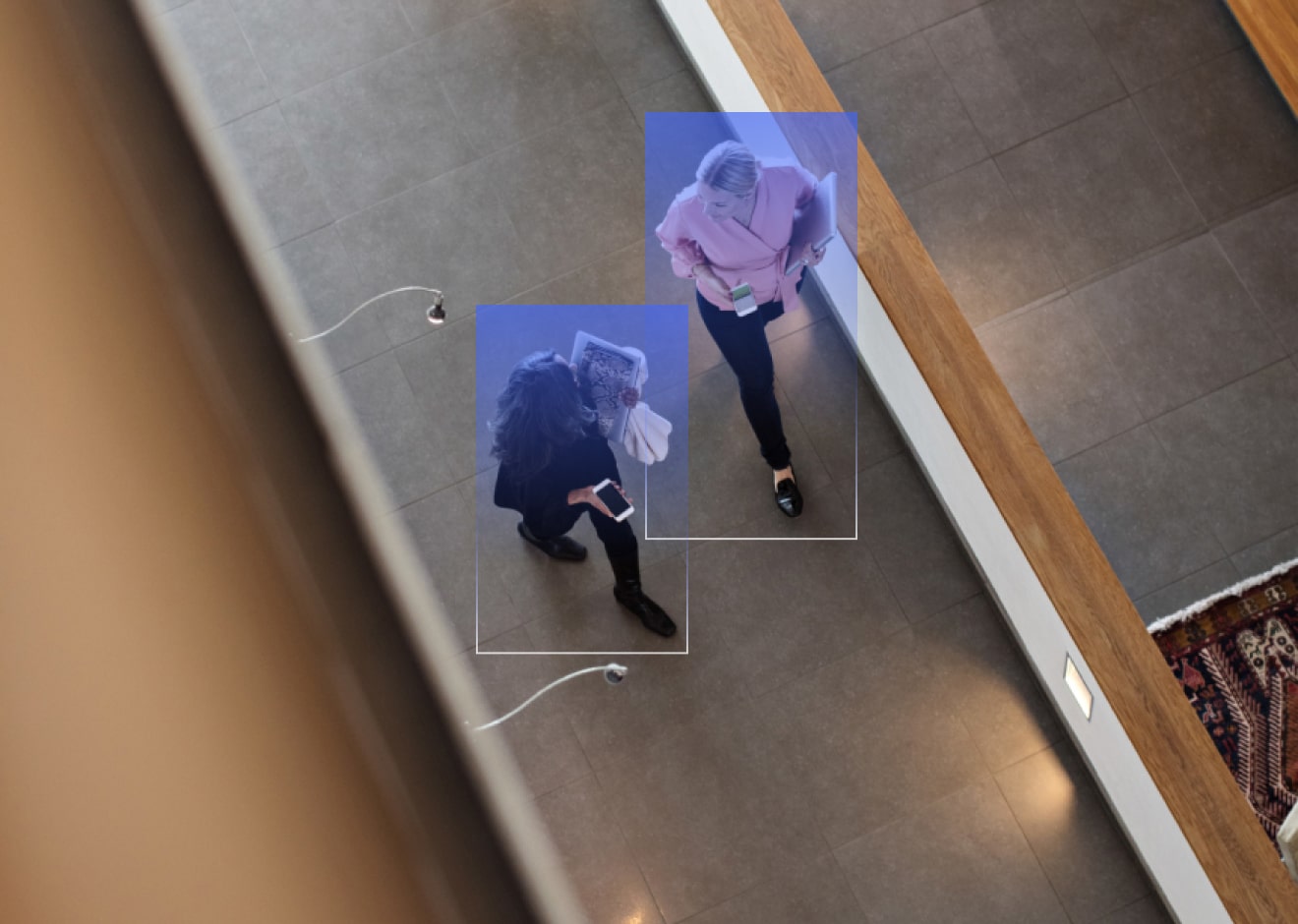 lumana ai video security brand imagery two persons walking view from the above 